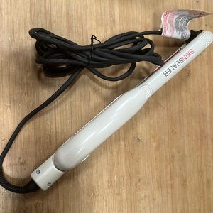 white and red flat iron